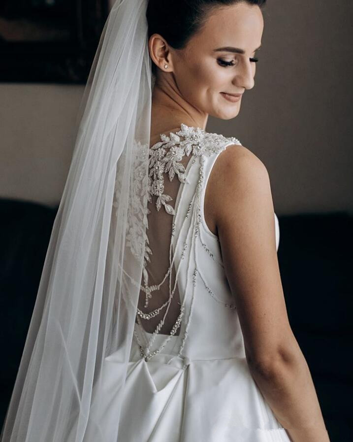 2020 Modest Satin Wedding Dresses Jewel Sleeveless Lace Applique Beaded vestido de noiva Sheer Back Bridal Gowns