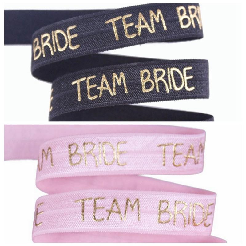 5/8" Gold foil Team Bride text FOE fold over elastic for wedding accessories welcome custom printed, 123
5/8" Gold foil Team Bride text FOE fold over elastic for wedding accessories welcome custom printed, 123