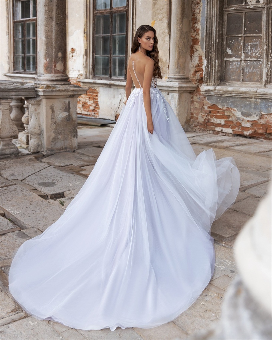 2020 Sexy A Line Wedding Dresses Illusion Bodice Sheer Neck Sleeveless Appliqued Sequins Beaded Court Train Custom Made Bridal Gowns