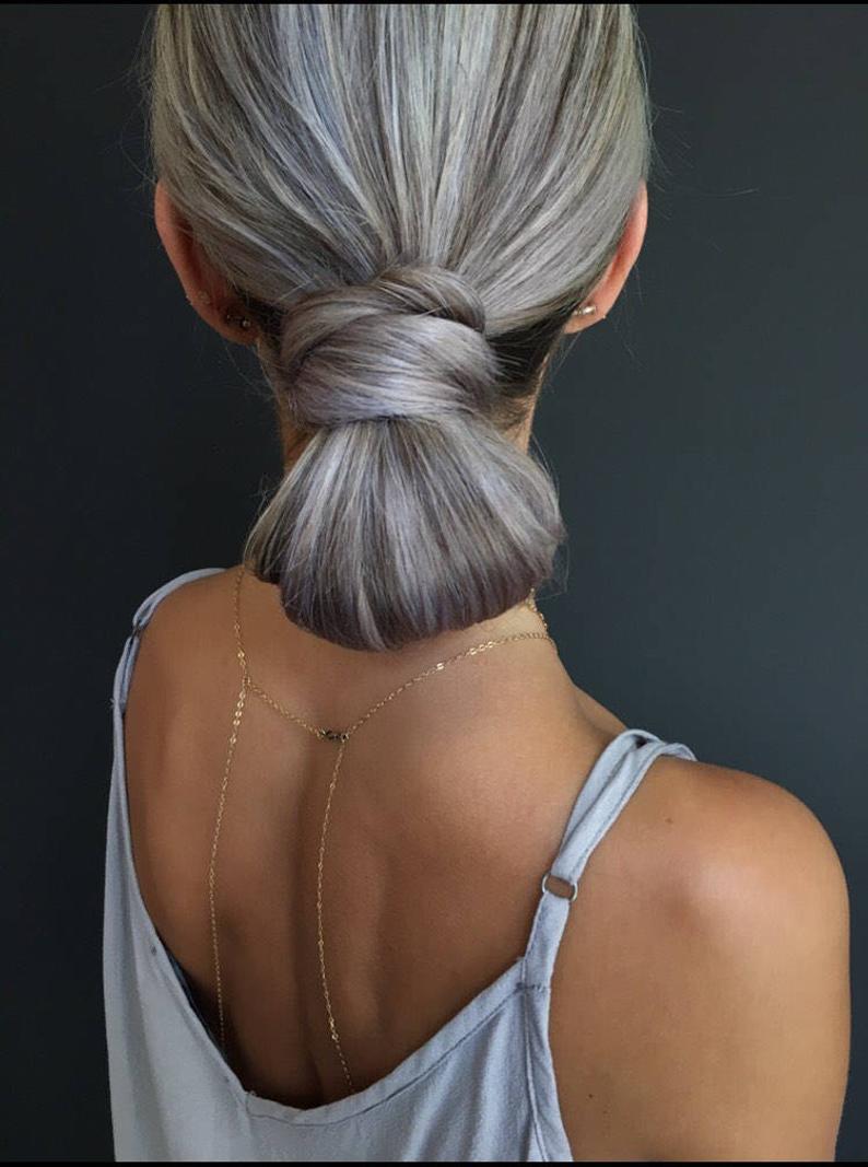Sleek silver grey straight ponytail hairpiece natural highlights natural looking dye free french braids dutch braids fashion grey hairstyle