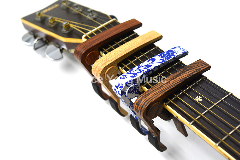 Rose Wood Sapele Blue&White PorcelainAcoustic/Electric Guitar 6-Strings Guitar Capo Change Capos Key Clamp Free Shipping
Rose Wood Sapele Blue&White PorcelainAcoustic/Electric Guitar 6-Strings Guitar Capo Change Capos Key Clamp Free Shipping