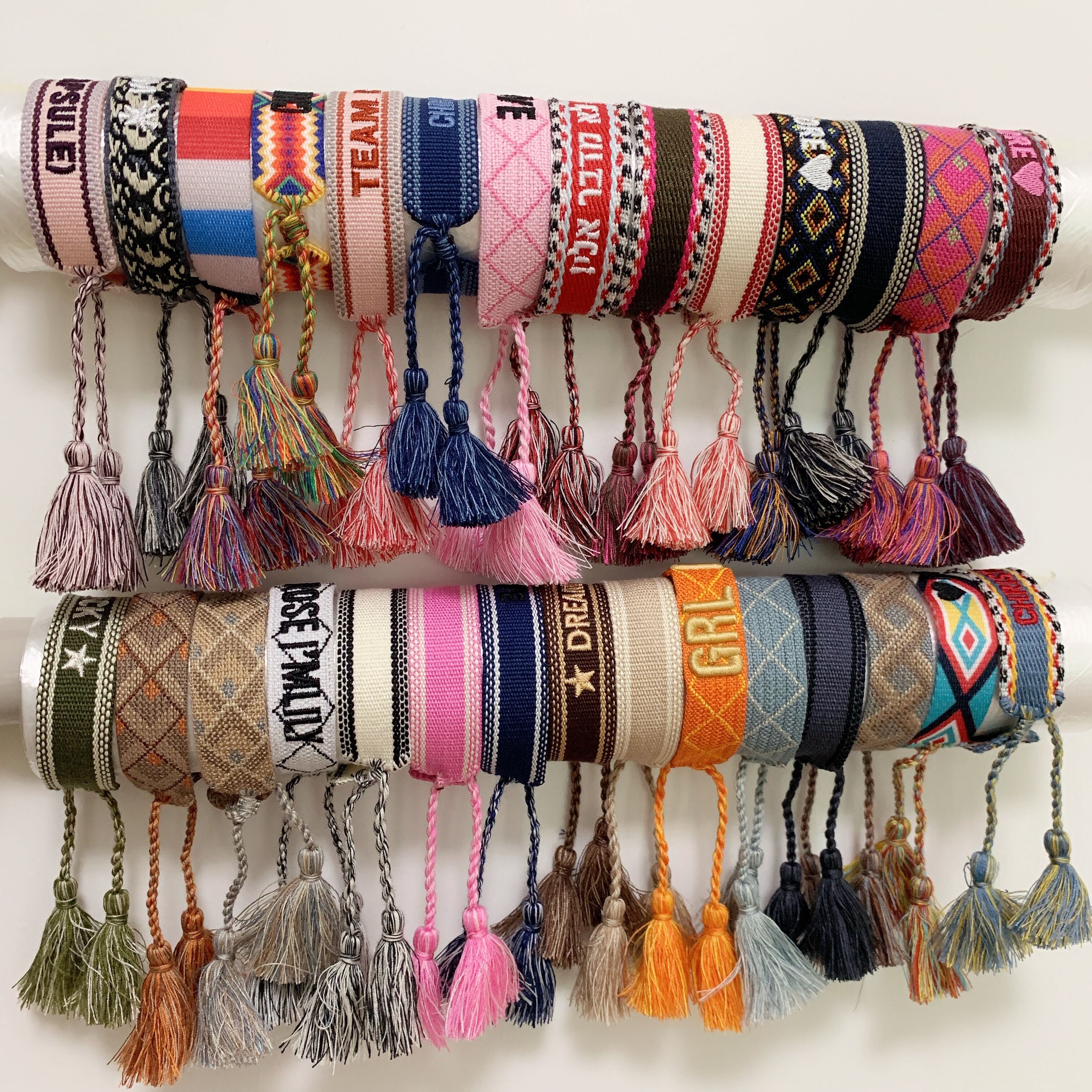 Luxury style rope material woven bracelet with sewing words and tassel hand strap brand jewelry for women gift
Luxury style rope material woven bracelet with sewing words and tassel hand strap brand jewelry for women gift