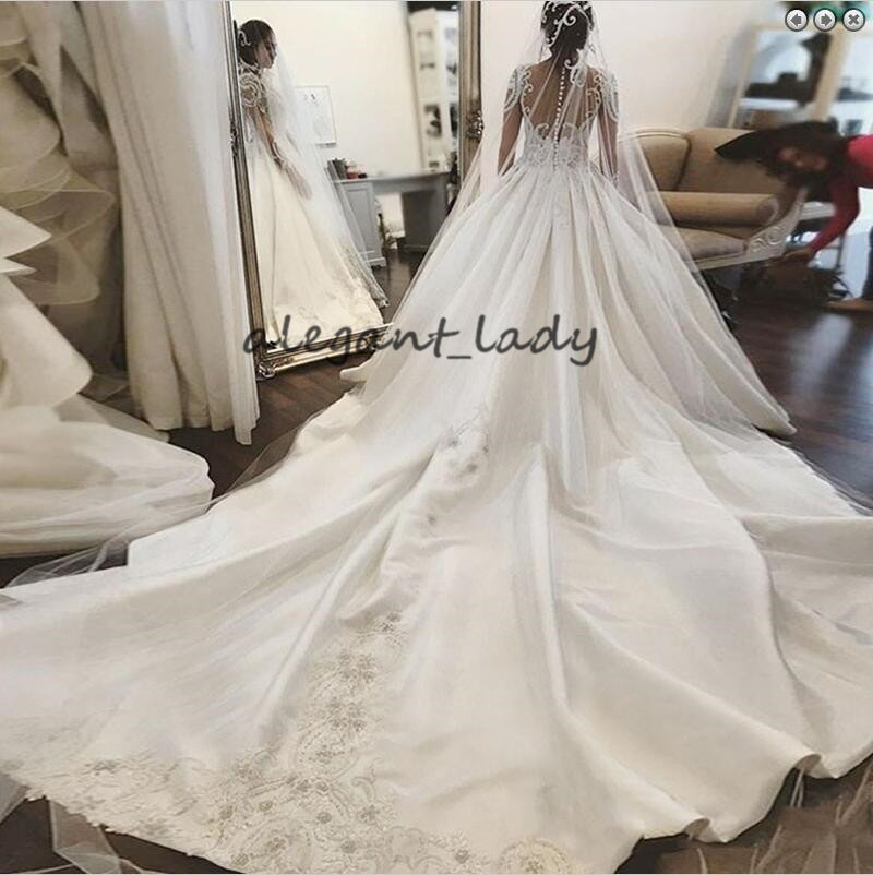 Round Neck Long Sleeves Chapel Train Wedding Dresses 2019 Luxury Lace Applique Middle East Arabic Princess Church Royal Wedding Gown Veil