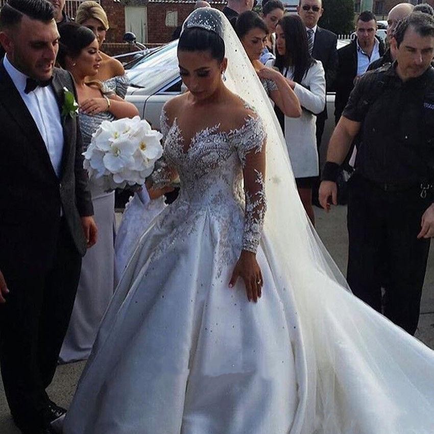 New Ball Gown Wedding Dresses Sheer Neck Long Sleeves Illusion Crystal Beaded Satin Sexy Back Chapel Train Plus Size Bridal Gowns