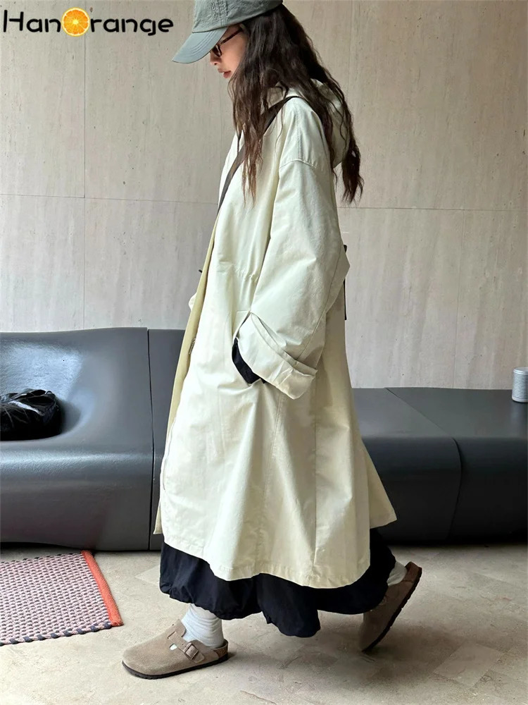 HanOrange 2024 Autumn Leisure Hooded Silhouette Windbreaker Women Windproof Long Trench Jacket Military GreenBeige Apricot 251231