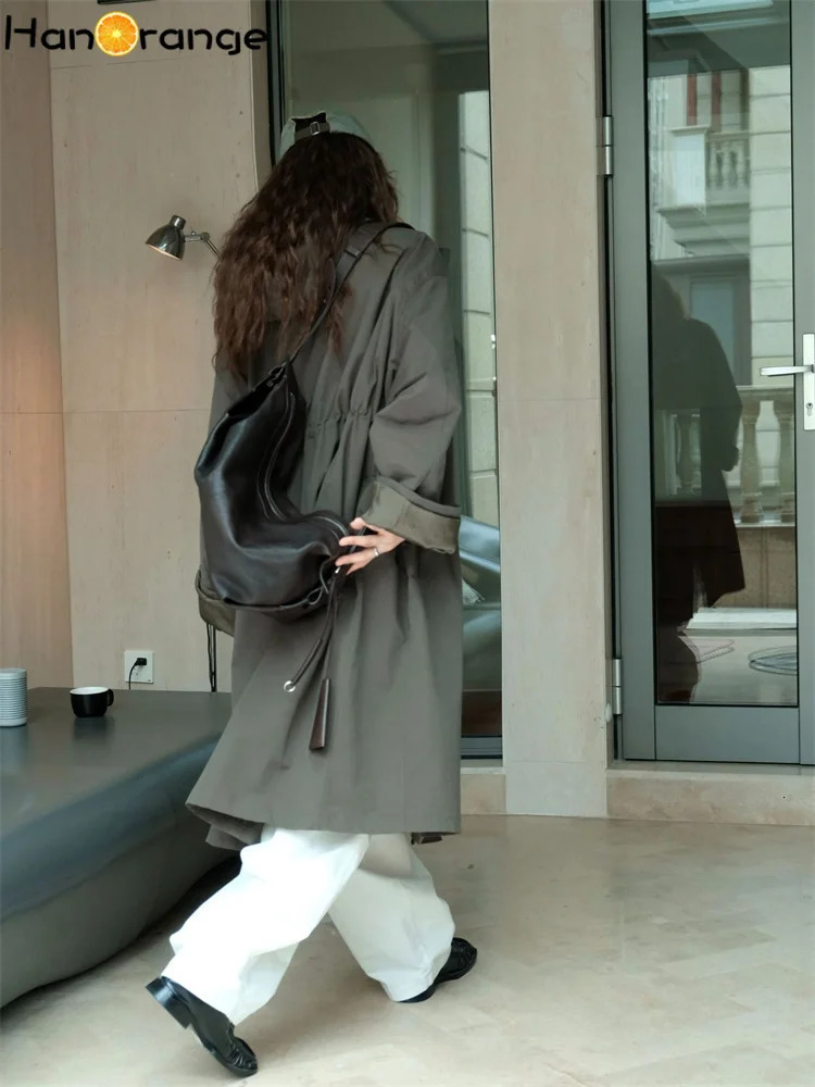 HanOrange 2024 Autumn Leisure Hooded Silhouette Windbreaker Women Windproof Long Trench Jacket Military GreenBeige Apricot 251231