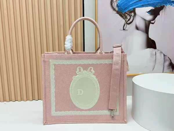 Arcadie matelasse Fashion Designer Handbag Shoulder Luxury tote Brand shoulder Bag Book tote - A canvas shopping tote bag in pink.