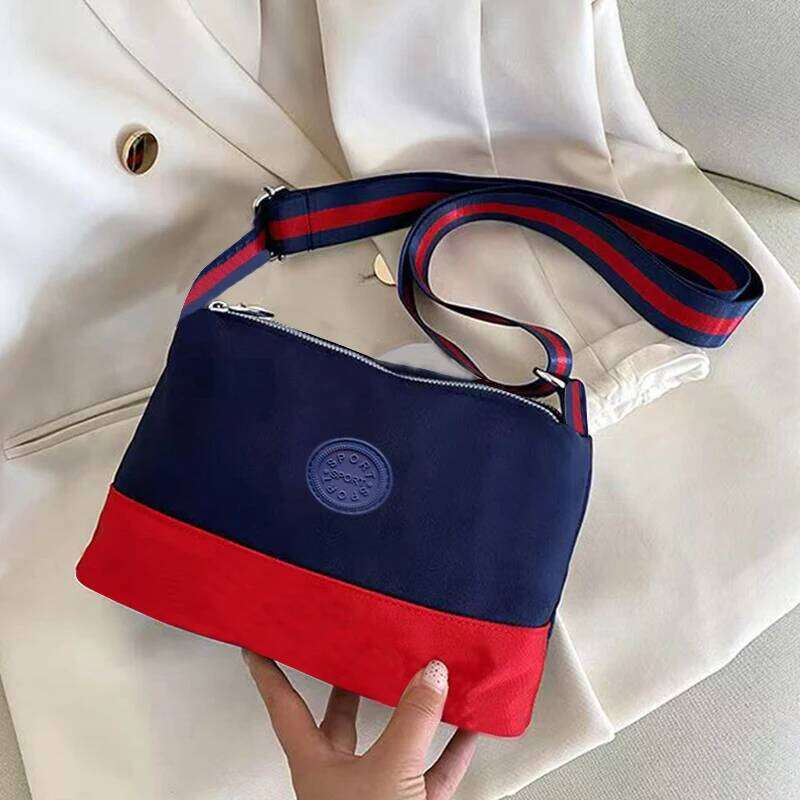 Neutral style bags men women, made of nylon material with zipper closure, suitable for traveling and shopping.