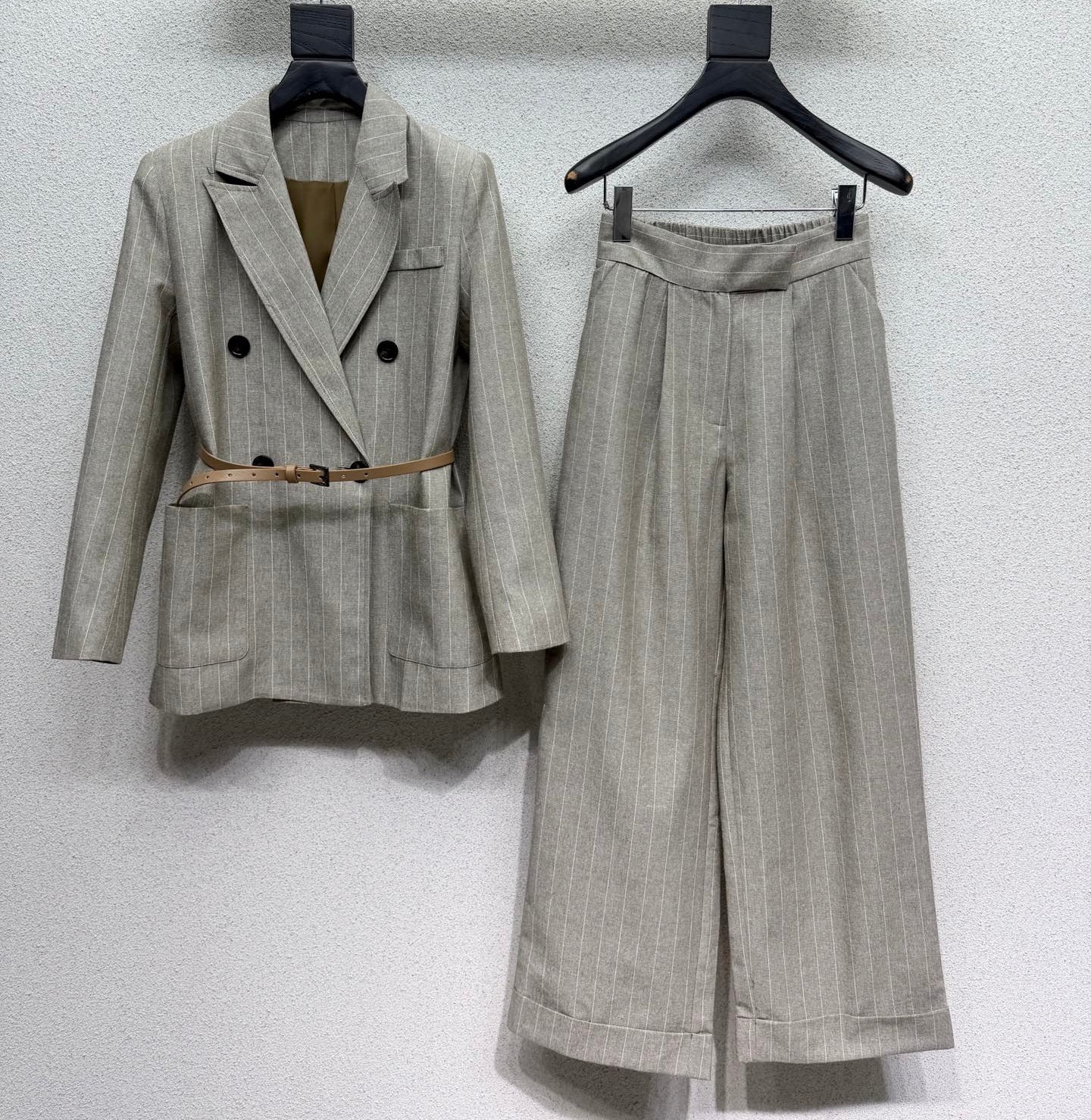 Designer suit set with striped linen double breasted waistband and waist cinching jacket paired with flared cropped trousers