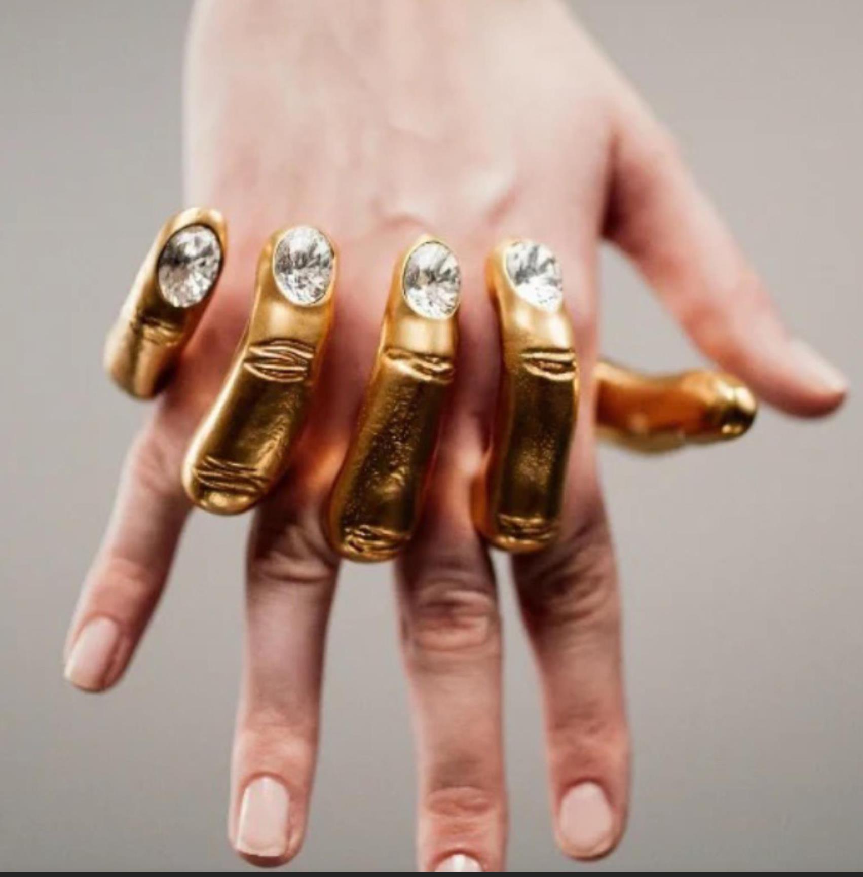 New Designed exaggerated hand-in-hand ring in gilded brass molded fingers adorned with rhinestone-encrusted nails Designer Jewelry Schiaparelli-R19012