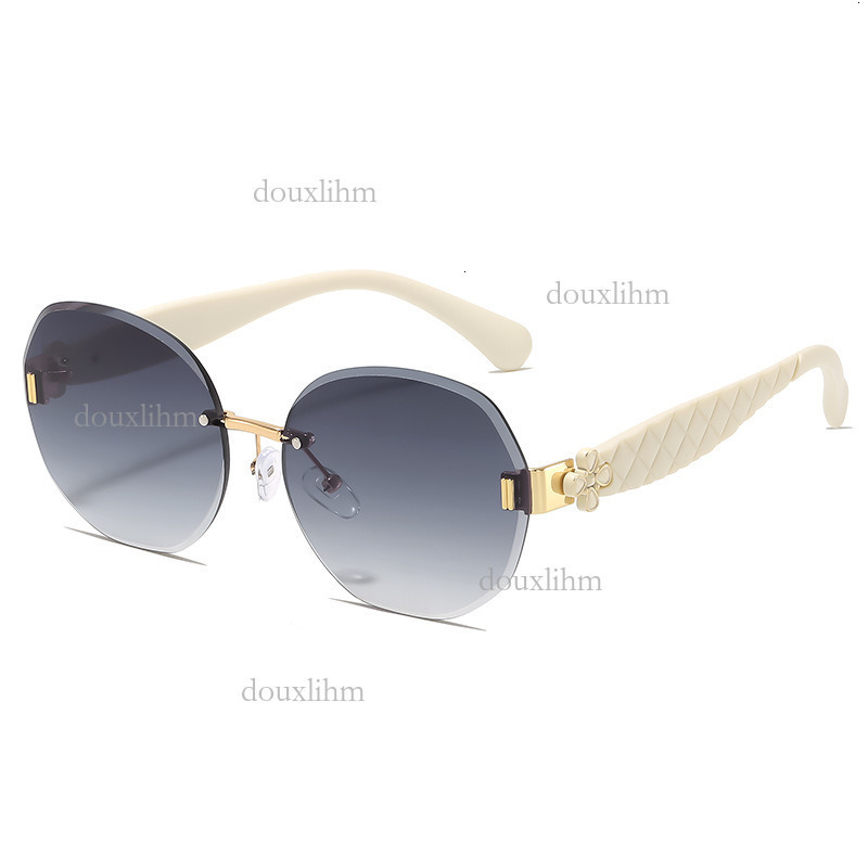 2026 Luxury Brand Fashion Accessories Designer Elliptical Frameless Glasses Wavy Clover Leg Sunglasses Women's Temperament Outdoor Sunglasses Who