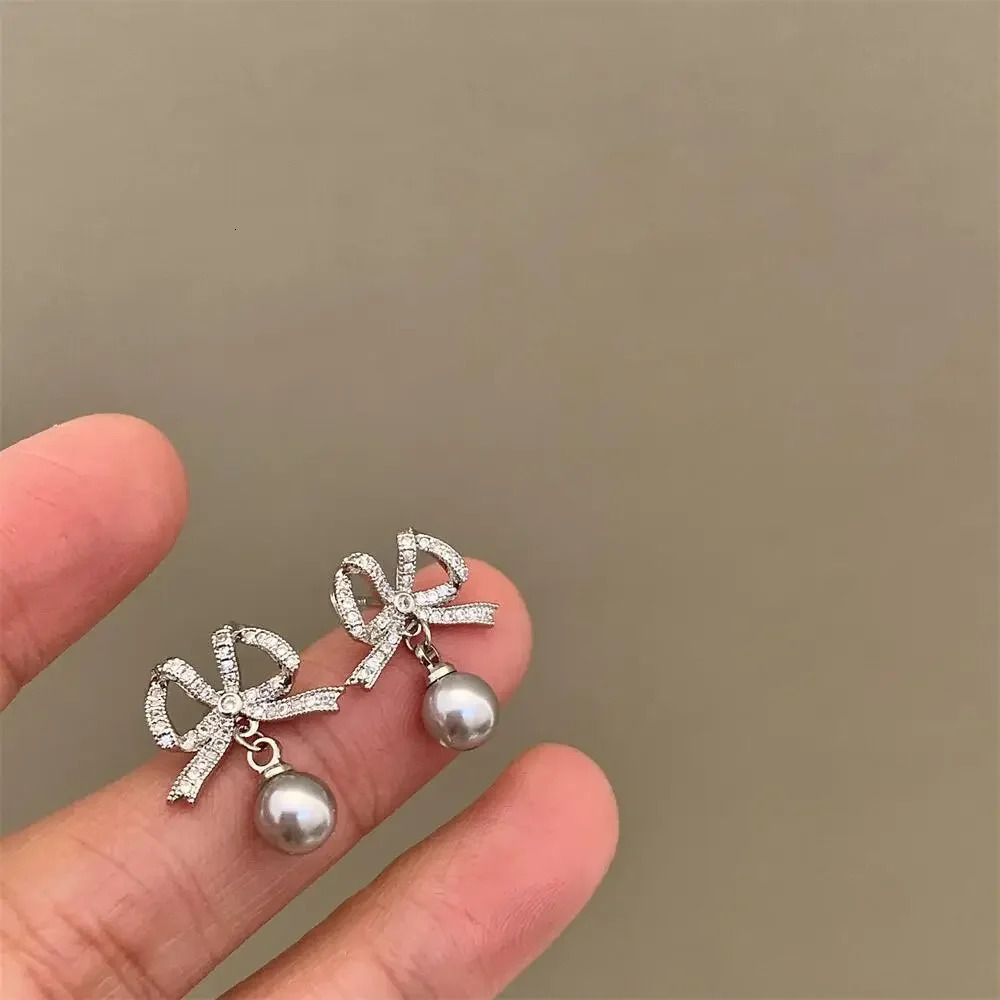 Korean Full Drill Butterfly Knot Earrings Womens High-End Elegant Pearl Zircon Silver Needle Ear Jewelry Fashion Accessories 260107