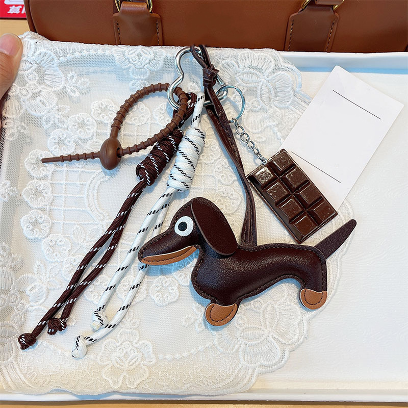 Fashionable and versatile retro sausage puppy car keychain bag pendant hanging rope chocolate woven rope accessory