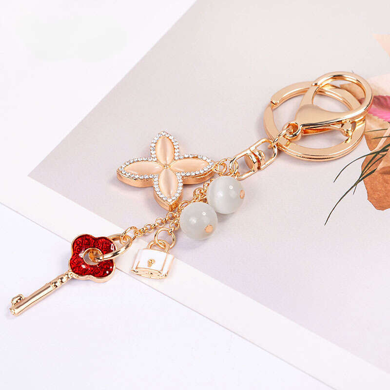 Cat's Eye Stone Four-Leaf Clover Fashionable Keychain Handbag Accessory Car Ornament Trendy Fashion Accessory