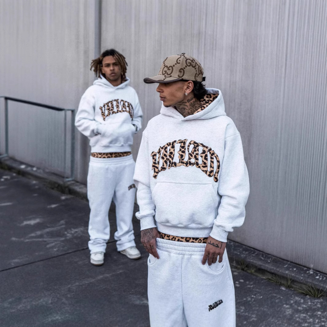 The 2026 New Model Of The Luxurious Brand's Design Features Striped Print Letter Embroidery Street Casual Pants With A Lining And A Hooded Design