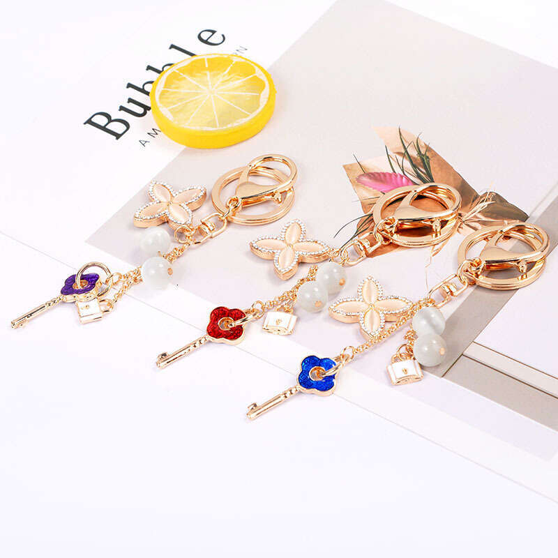 Cat's Eye Stone Four-Leaf Clover Fashionable Keychain Handbag Accessory Car Ornament Trendy Fashion Accessory