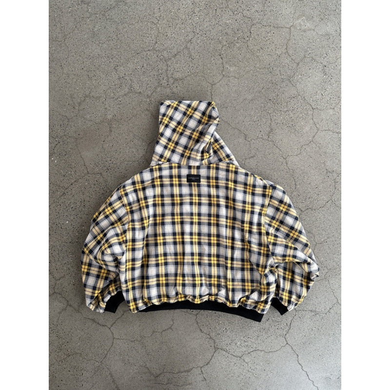 The Clothing Designed By A Luxury Brand Designer Is A Double Zipper Hooded Sweatshirt With A Retro Yellow Checkered Pattern That Can Be Flipped Over I
