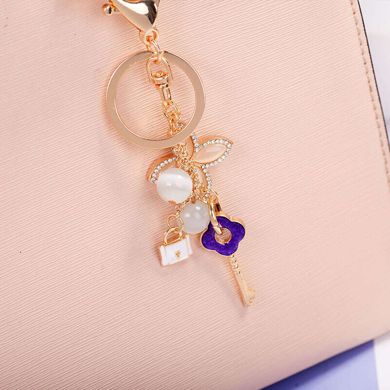 Cat's Eye Stone Four-Leaf Clover Fashionable Keychain Handbag Accessory Car Ornament Trendy Fashion Accessory