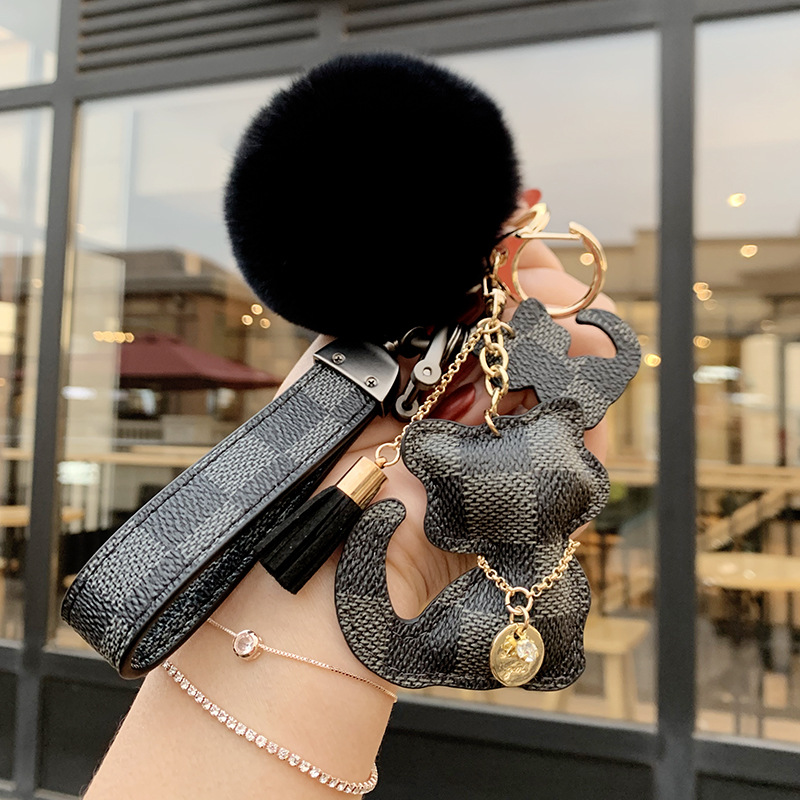 keychains Fashion 2026 Cute Cat and Bear Keychain Checkered PU Leather Fur Pom-pom Wrist Strap Tassel Coin Bag Car Decor