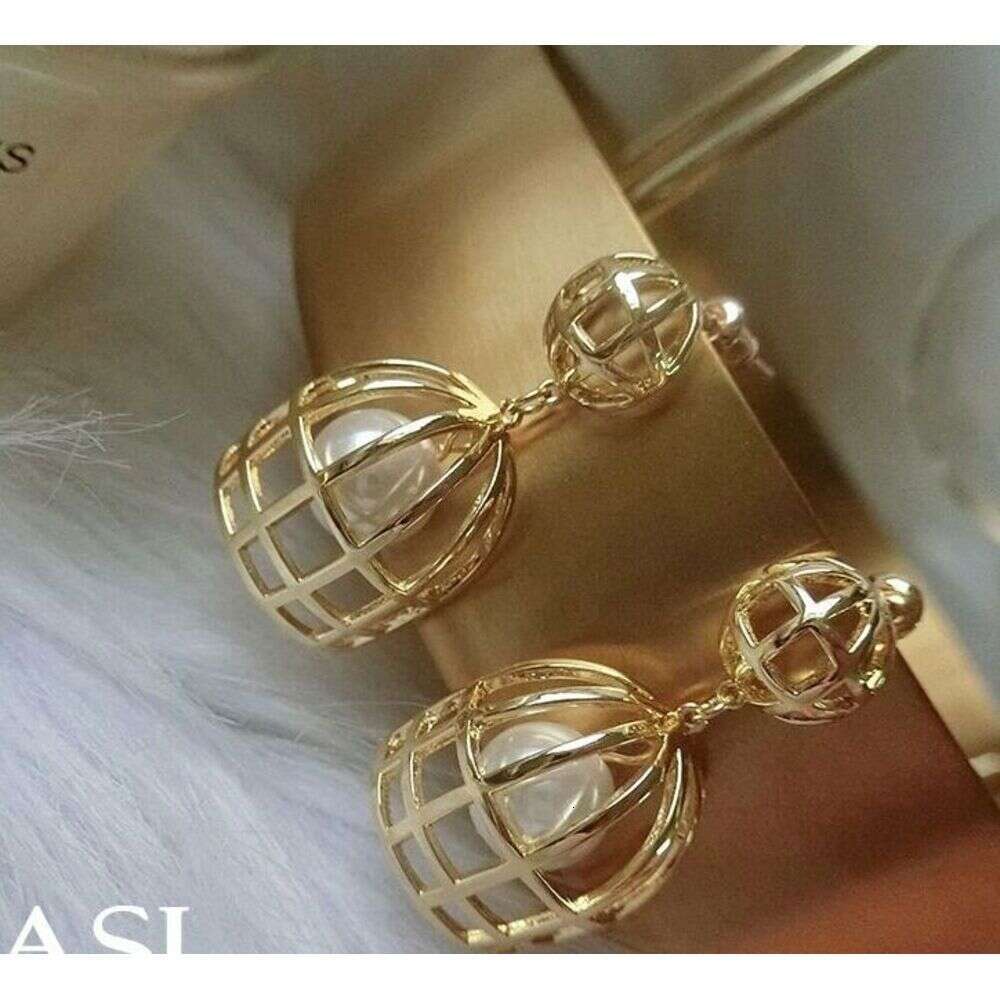 Exaggerated large pearl birdcage earrings niche design sense 2026 new popular European and American high-end earrings women's ea