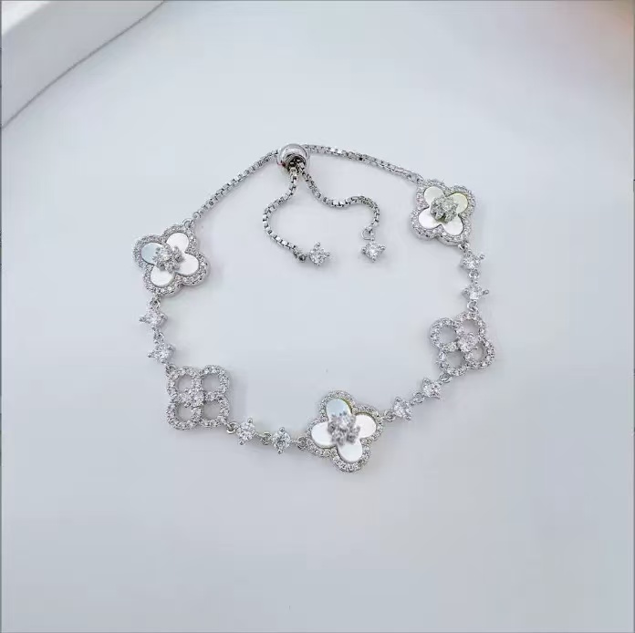 Elegant Pink Floral Design Charm Bangle: Four-Leaved Lucky Charms Accented by Tiny Sparkling Cubic Zirconia Stones for Women's Jewelry Collection