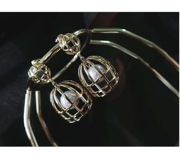 Exaggerated large pearl birdcage earrings niche design sense 2026 new popular European and American high-end earrings women's ea