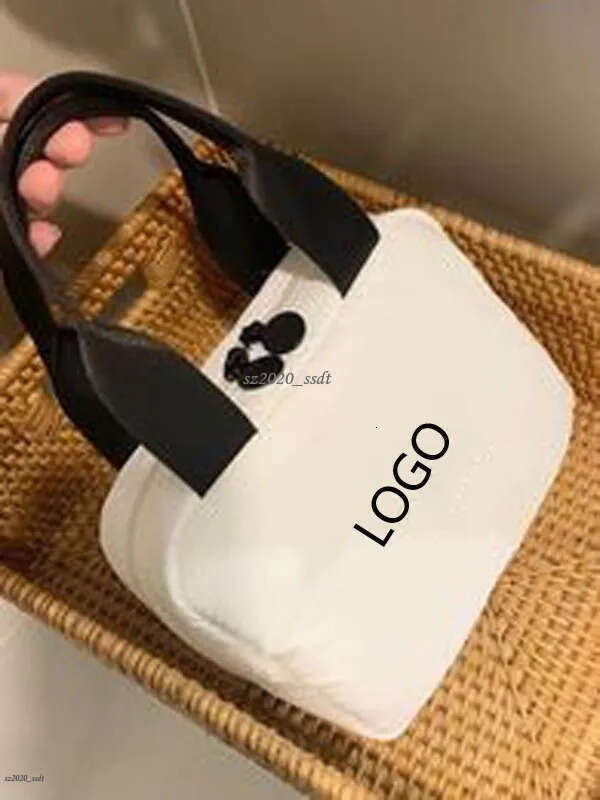 Designer's white handbag with embroidered letter logo, camellia, soft and oversized makeup bag toiletry bag