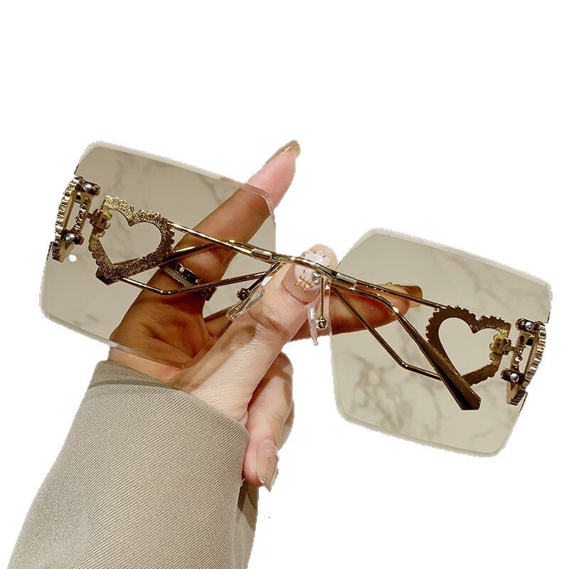 Luxury Brand Designer Sunglasses New Sunglasses Rimless Cut Edge Sunglasses Large Frame Slimming Heart Frame Metal European And American Fashion Stree