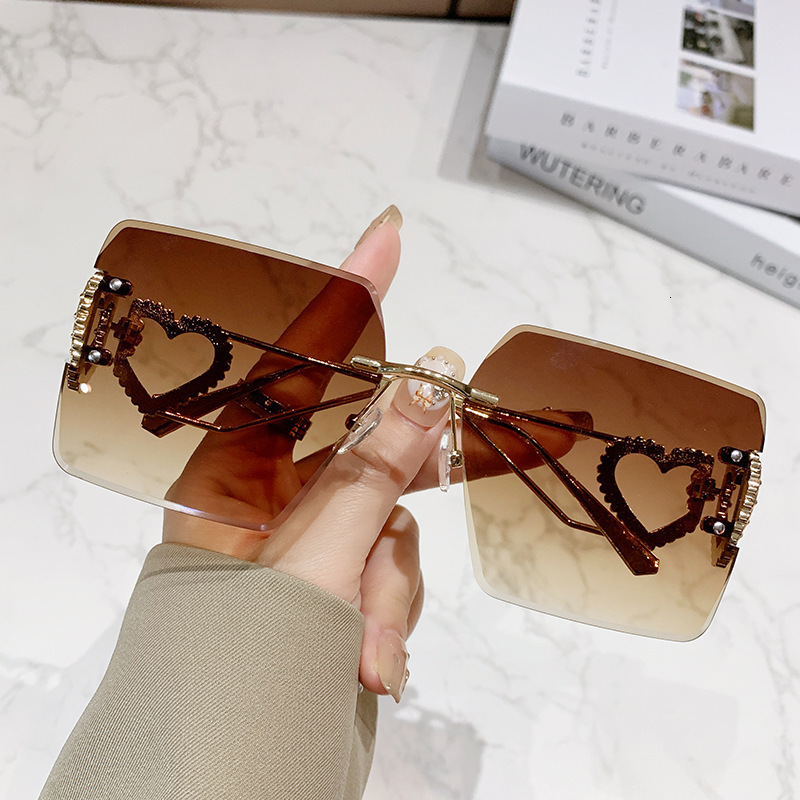 Luxury Brand Designer Sunglasses New Sunglasses Rimless Cut Edge Sunglasses Large Frame Slimming Heart Frame Metal European And American Fashion Stree