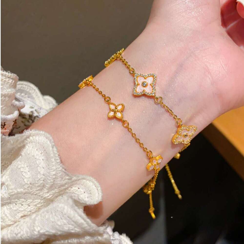 Dainty Floral Four Leaf Clover Bracelet with Pink Enamel Inlay and Zircon Gold Lightweight and Adjustable for Daily Wear and for Layering