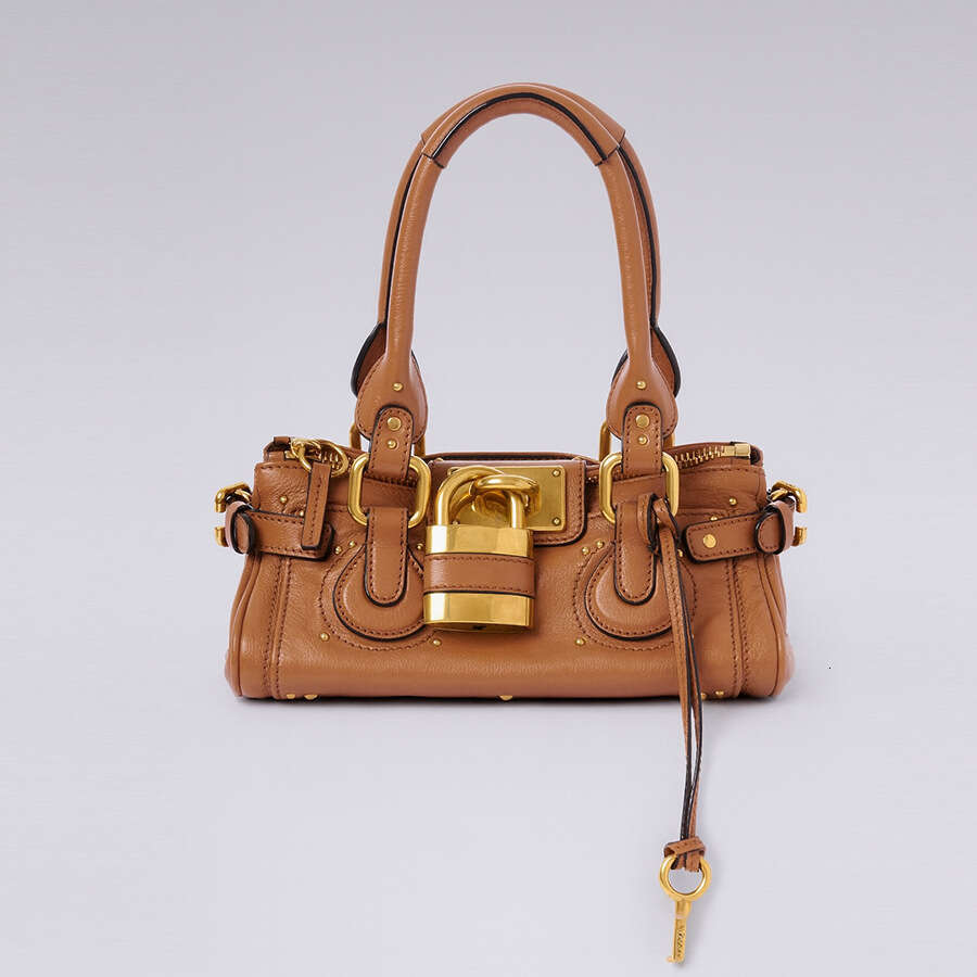 Women 2026 Cross Border New Autumn European And Retro Style Versatile Fashion Lock Rivet Pillow Bag Women S Handbag