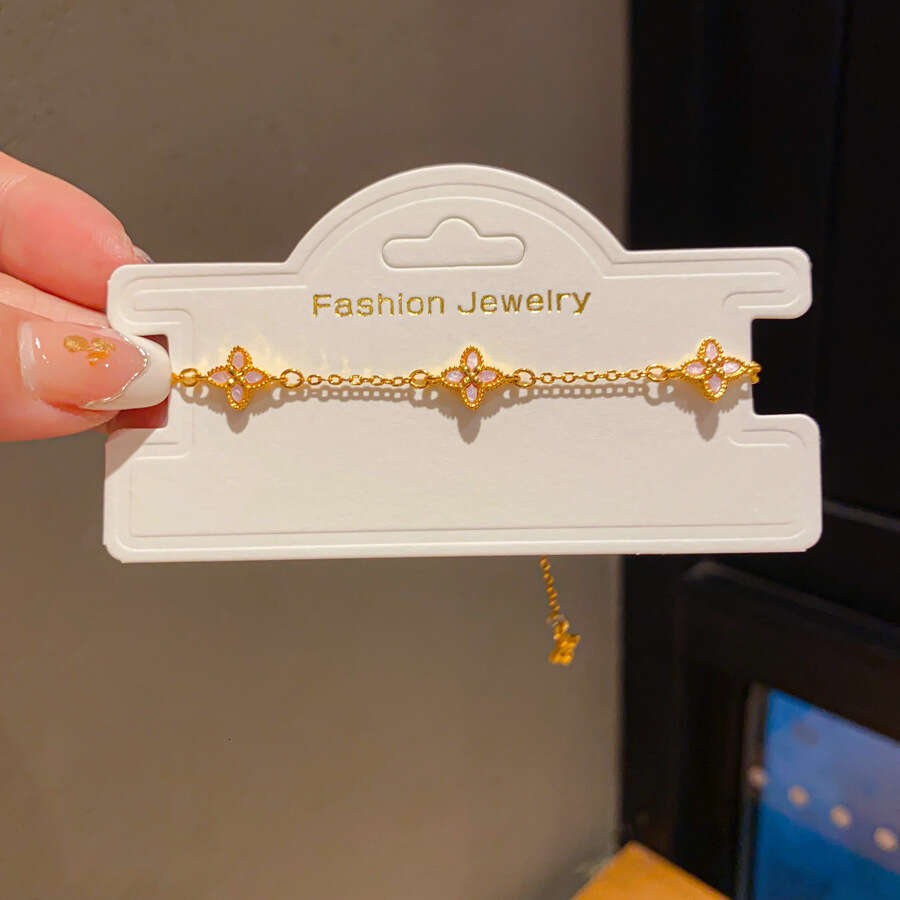 Dainty Floral Four Leaf Clover Bracelet with Pink Enamel Inlay and Zircon Gold Lightweight and Adjustable for Daily Wear and for Layering