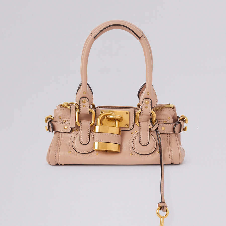 Women 2026 Cross Border New Autumn European And Retro Style Versatile Fashion Lock Rivet Pillow Bag Women S Handbag