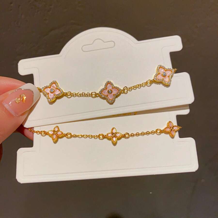 Dainty Floral Four Leaf Clover Bracelet with Pink Enamel Inlay and Zircon Gold Lightweight and Adjustable for Daily Wear and for Layering