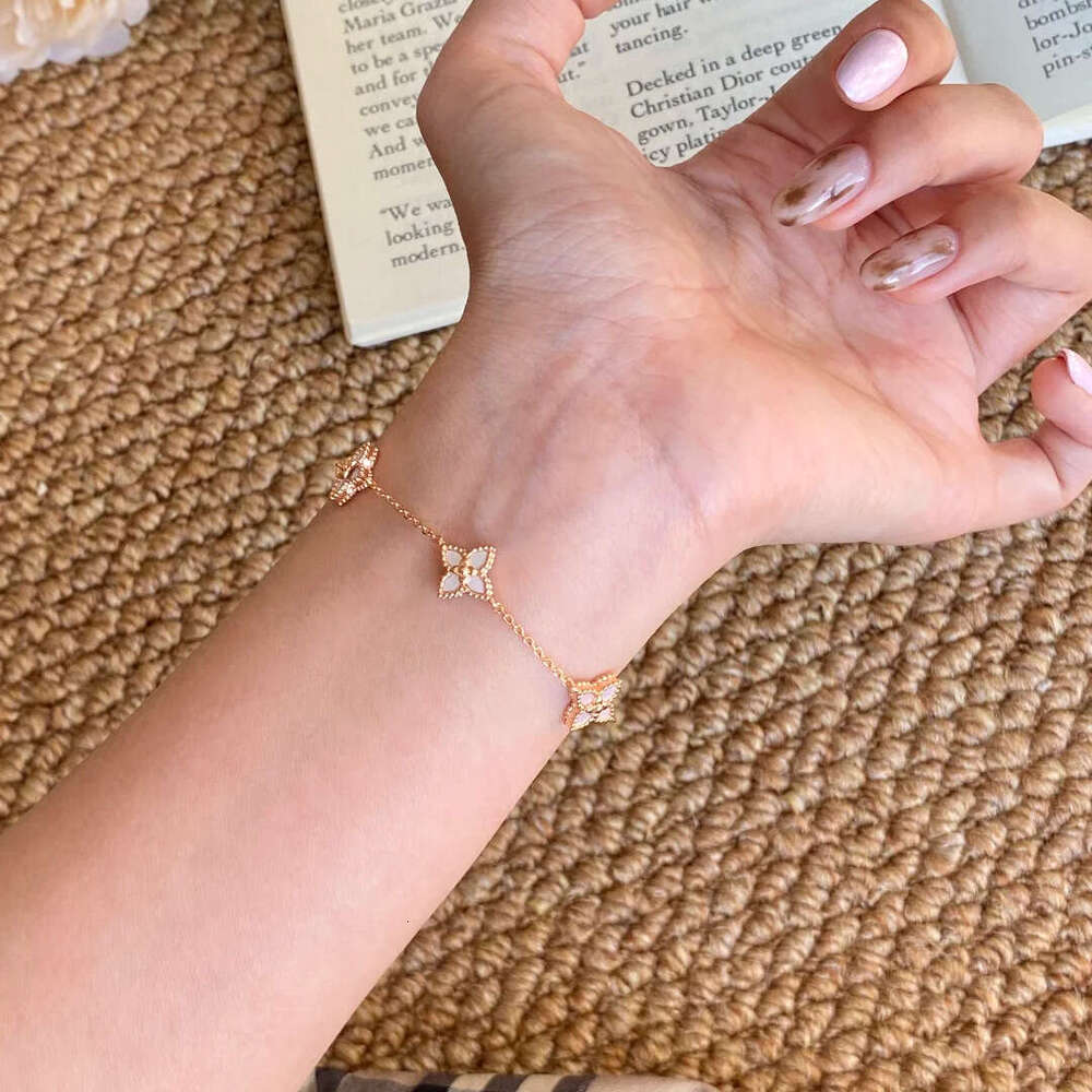 Lightweight dainty gold tone four leaf clover motif bracelet with of inlay smooth accents for Women