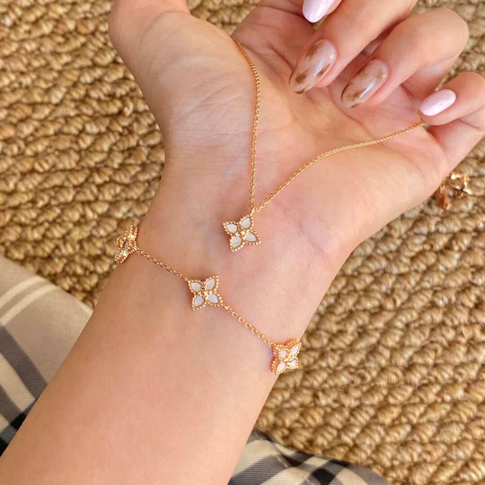 Lightweight dainty gold tone four leaf clover motif bracelet with of inlay smooth accents for Women