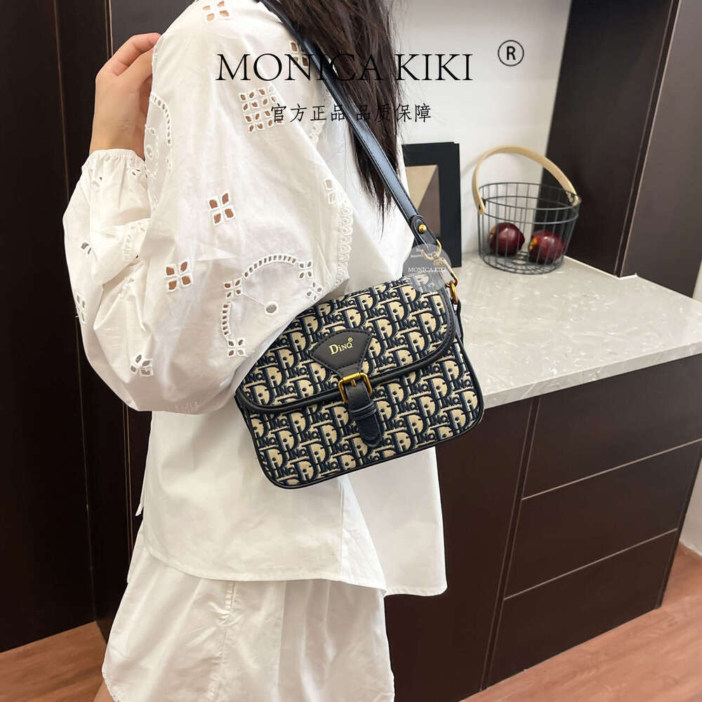 Monica kiki Monogram Jacquard Free shipping Embroidery Fashion Versatile Saddle Bag for Women with Wide Shoulder Strap Casual Crossbody