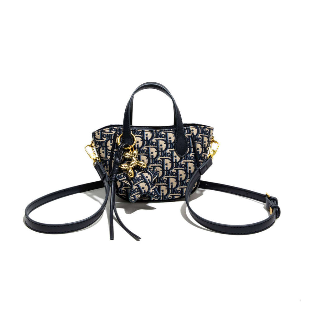 Monica kiki Light Luxury Jacquard Embroidery Handheld Bucket for Women New Large Capacity High-end Crossbody Bag