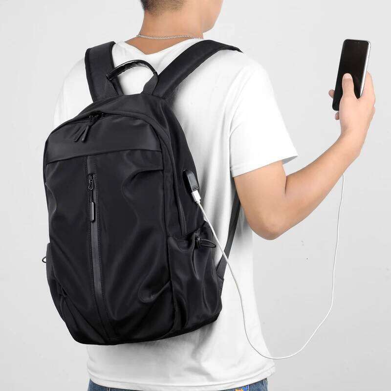 Simple solid color backpack with laptop compartment and USB charging port, suitable for travel, commuting, school, business Z260124