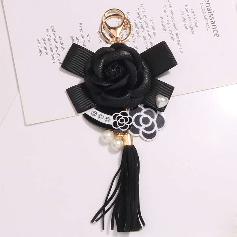 Tassel keychain Camellia flower bow pendant A fashionable accessory for commuting and dating