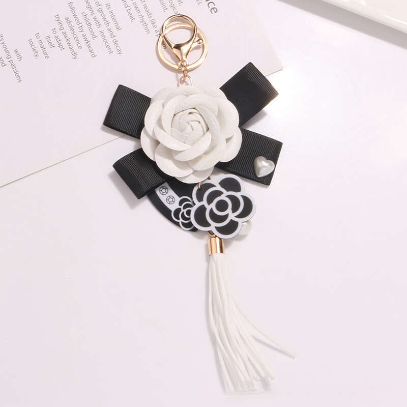 Tassel keychain Camellia flower bow pendant A fashionable accessory for commuting and dating