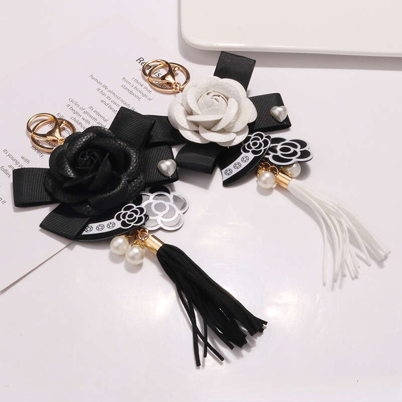 Tassel keychain Camellia flower bow pendant A fashionable accessory for commuting and dating