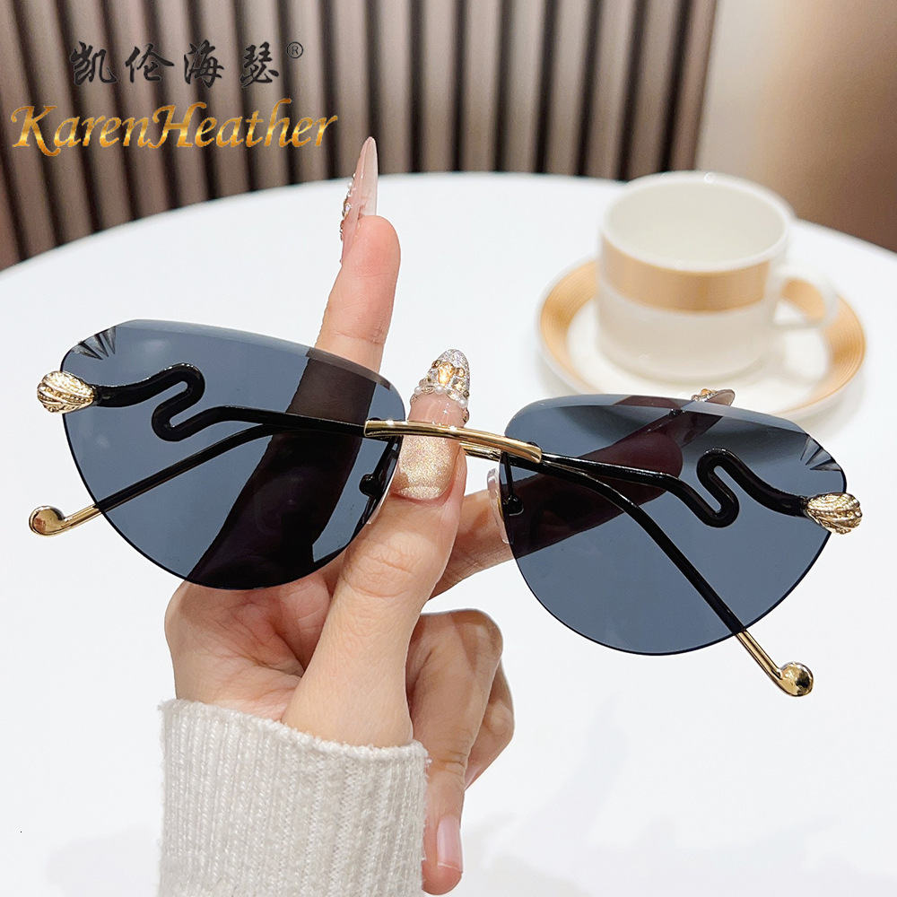 New Cat Eye Rimless Sunglasses 2026 European And American Style Cut Edge Fashion Snake Head Sunglasses For Women Luxury Fashion Eyewear UV Protection 