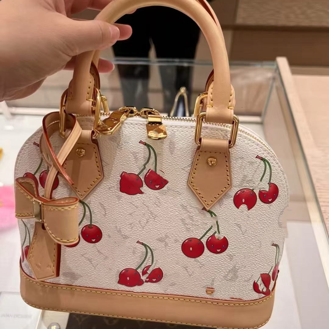 Top Quality Designer bag 2025 New White Three-Color Cherry Shell Womens Handbag Large Capacity Shoulder Bag Trendy Fashionable Stylish