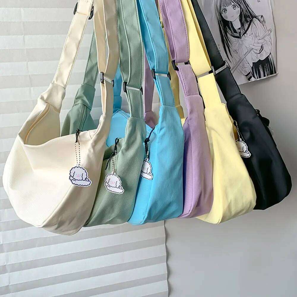 Korean Style Lightweight Shoulder Cream Solid Color Canvas with Pendant Handbag Messenger Simple Dumpling Bag XJ260125