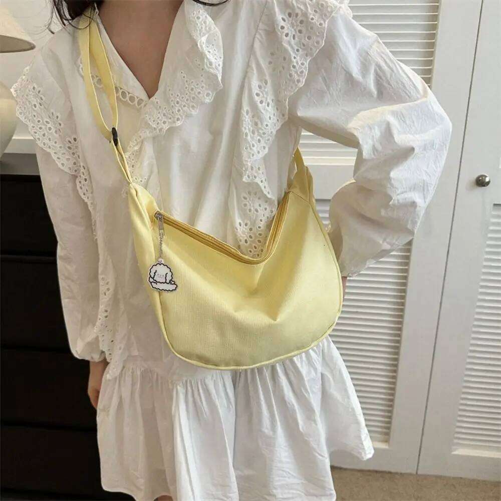 Korean Style Lightweight Shoulder Cream Solid Color Canvas with Pendant Handbag Messenger Simple Dumpling Bag XJ260125