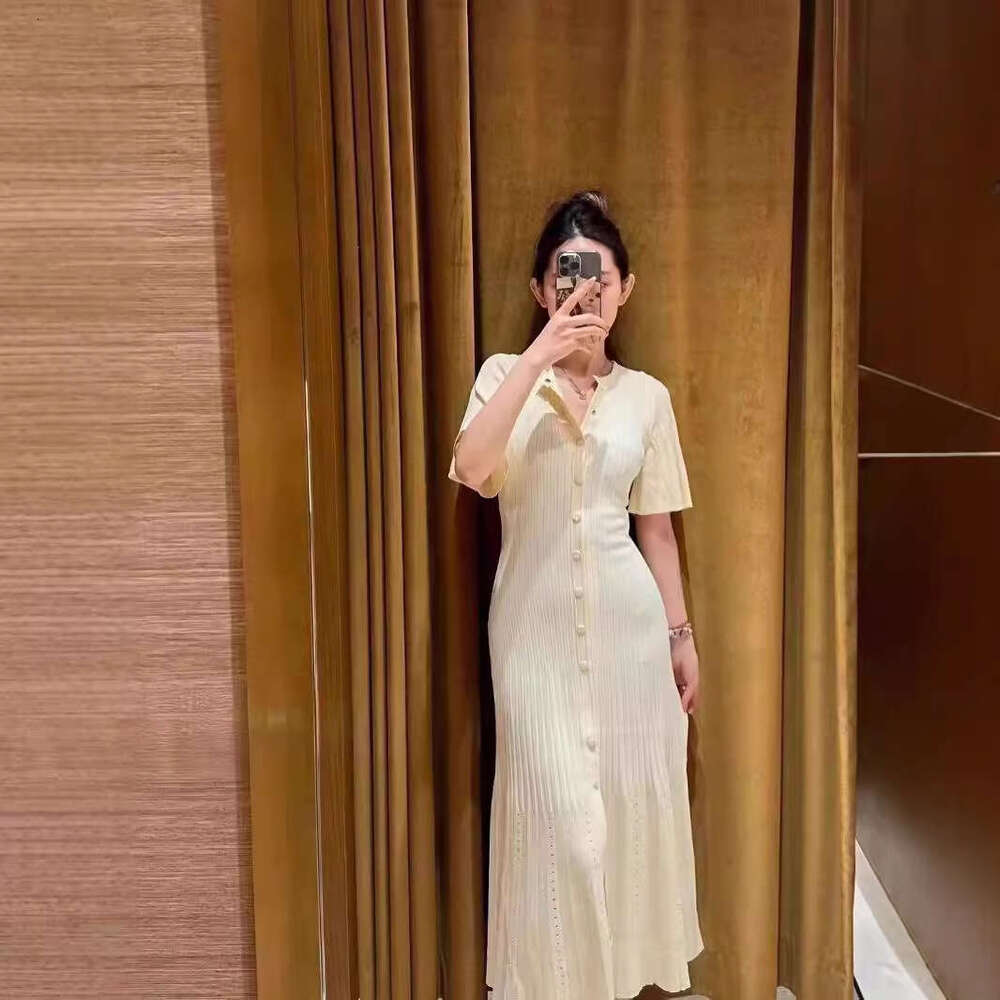 French Elegance 2026 Spring/Summer New Single breasted Round Neck Hollow Mermaid Knitted Waist Skirt for Women