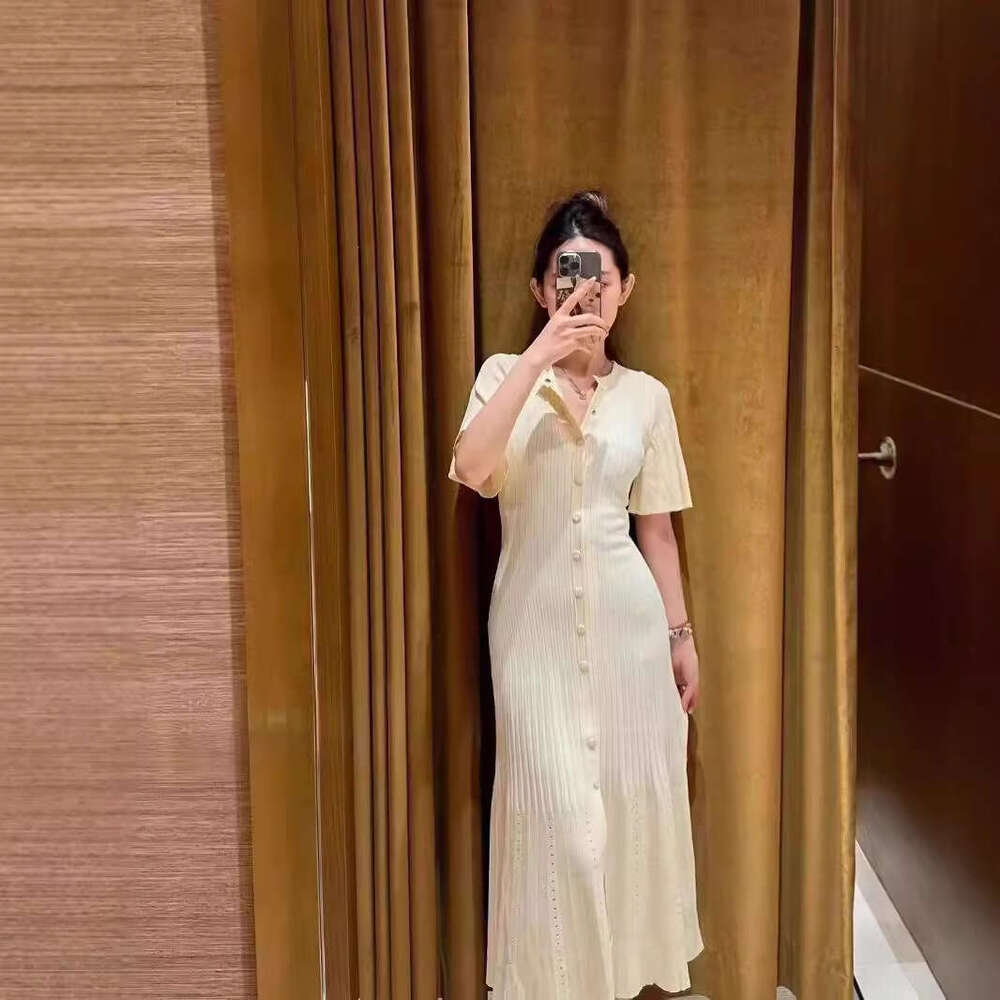 French Elegance 2026 Spring/Summer New Single breasted Round Neck Hollow Mermaid Knitted Waist Skirt for Women