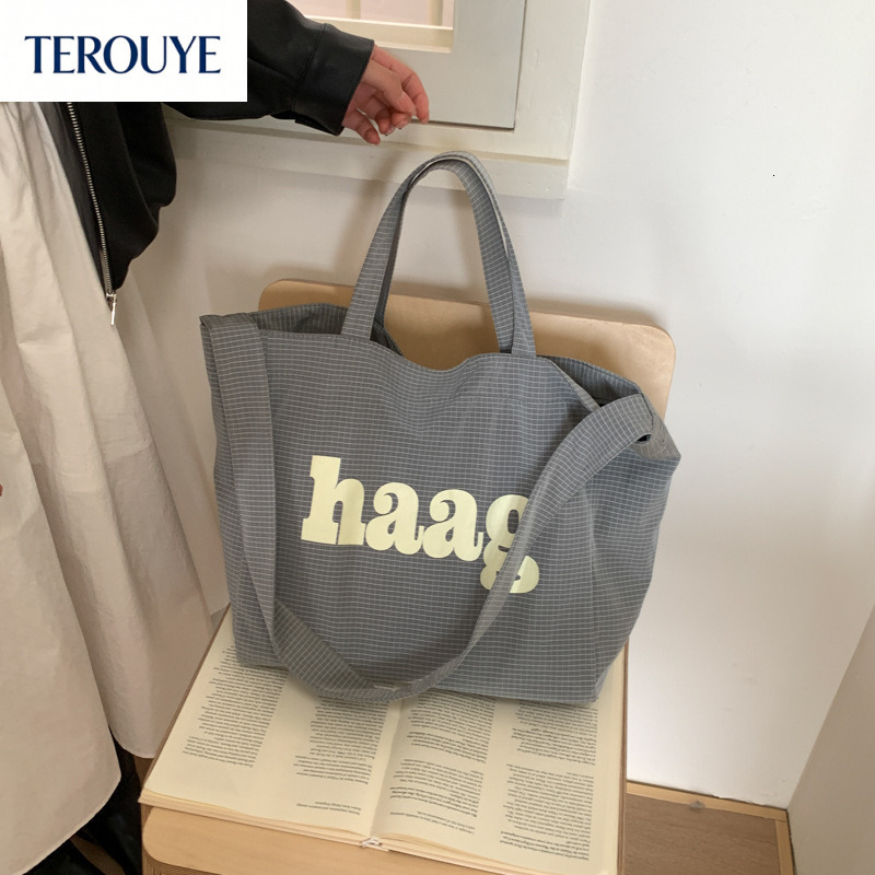 TEROUYE autumn bag and winter new Korean letter simple style niche design fashionable large capacity canvas bag women's shoulder bag