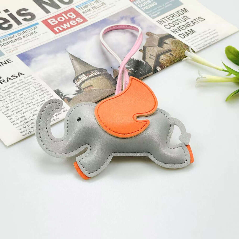 Mascot Leather Creative Backpack Car Keychain 3D Cute Flying Elephant Pendant Candy Color S260126